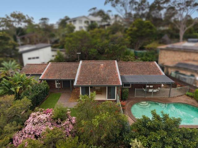 Family home with panoramic views of Bondi, Sydney CBD & Chatswood city skylines and further scope in a leafy setting