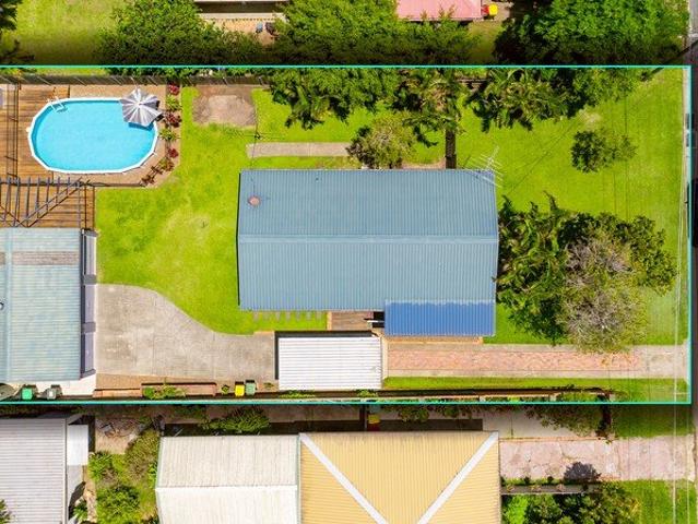 Family home, side access to triple shed plus pool!