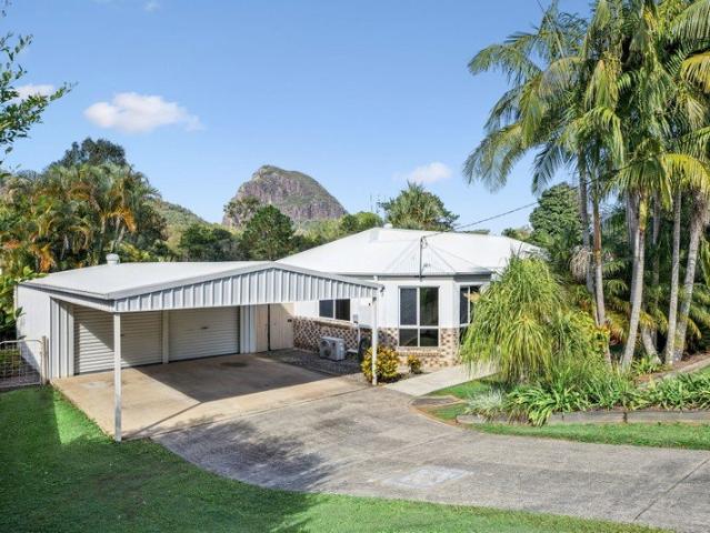Family living with Mount Tibrogargan views