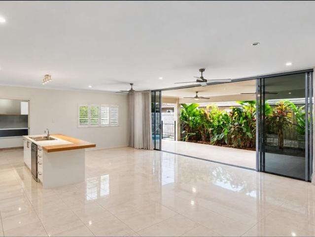 Family living with tropical pool minutes from the beach