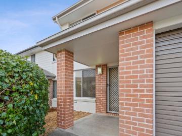 FANTASTIC OPPORTUNITY! Townhomes don't get better than this Resort Style Secure Living!