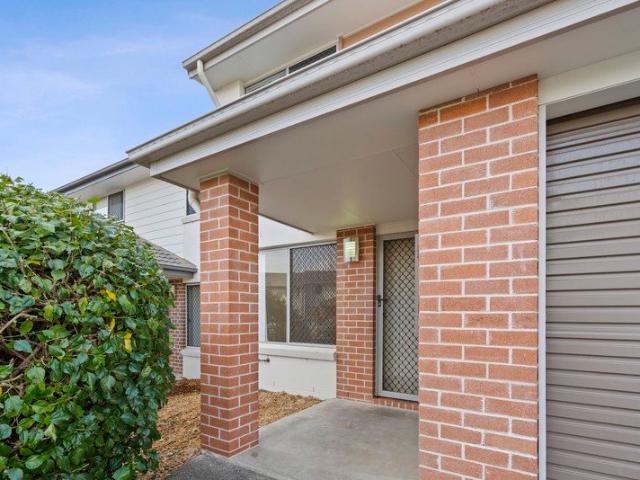 FANTASTIC OPPORTUNITY! Townhomes don't get better than this Resort Style Secure Living!