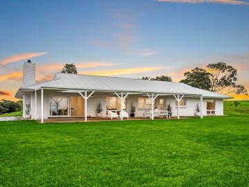 Farmhouse grace, horizon wide views, and 74 acres of country freedom.