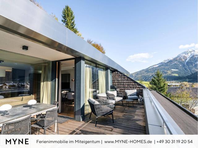 Ferienimmobilie im Miteigentum: Moderne Terrassenwohnung mit Panoramablick auf die Berge