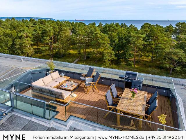 Ferienimmobilie in Miteigentum: Penthouse in erster Meereslinie mit Dachterrasse, Sauna und Pool
