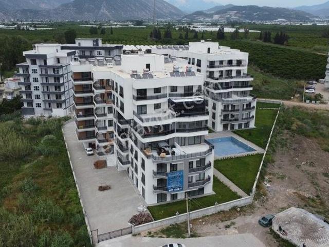 Finike Sahilde Lüks Projede Deniz Manzaralı Satılık 1+1 Rezidans