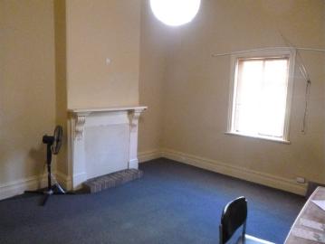 FOR LEASE ! 46 Woodville Road corner of Church Street only Steps from Q.E.H. Spacious Studio 4 Room complex disabled toilet and shower