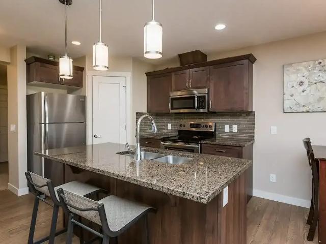 FORMER SHOW HOME FOR RENT — 2 Bedrooms+ Den Duplex