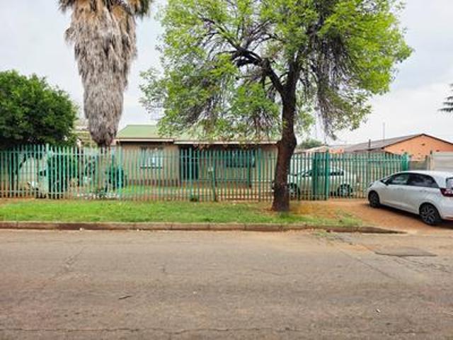four bedroom house with two outbuili.