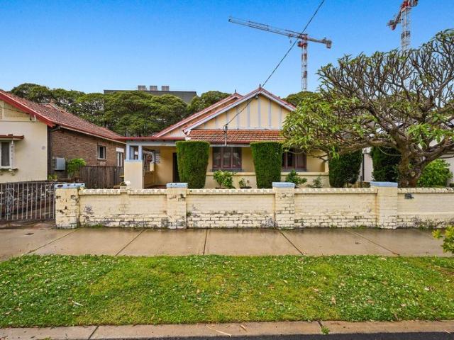 Four Bedroom Home with Outstanding Potential in Prime Kensington Location