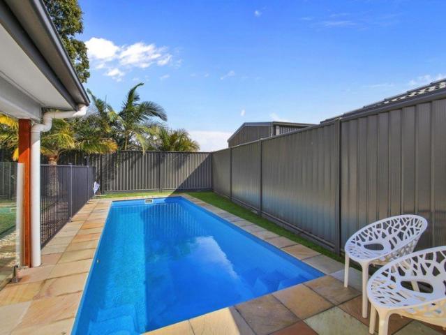 Four bedroom home with inground pool in sought after location