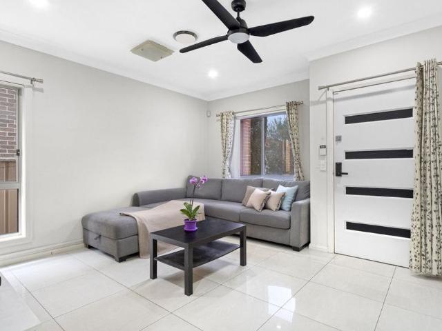 Four Bedroom Townhouse with Solar, Downstairs Bedroom & Oversized Entertaining Deck!