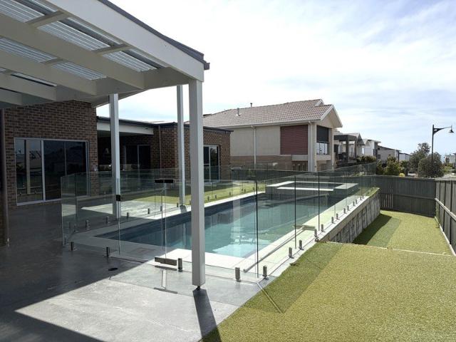 FOUR BEDROOM,THREE LIVING, FAMILY HOME OFFERS THE BEST IN RESORT STYLE LIVING