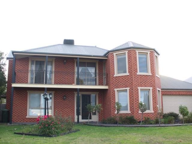 FOUR BEDROOM, THREE LIVING FAMILY HOME