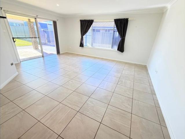 FOUR BEDROOMS, MULTIPLE LIVING AREAS & SPACIOUS BACKYARD
