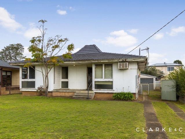 FOUR BEDROOMS AND PLENTY OF POTENTIAL!