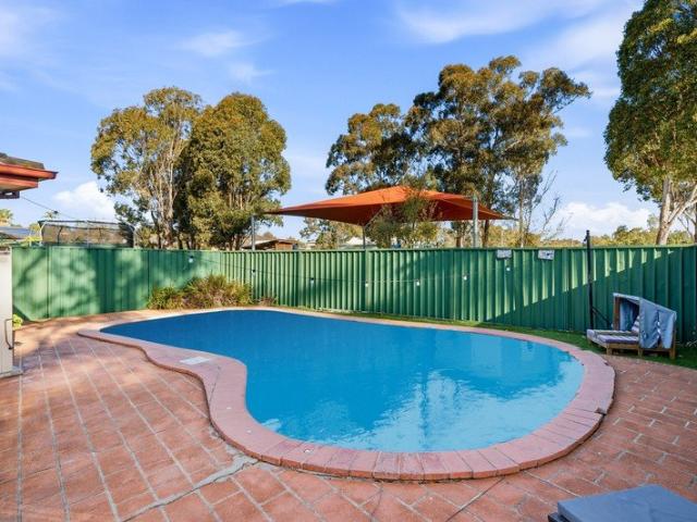 Four Bedrooms, Privacy & In Ground Pool!