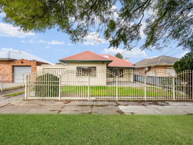 Four Bedrooms with Rear Access and a Garage/Workshop!