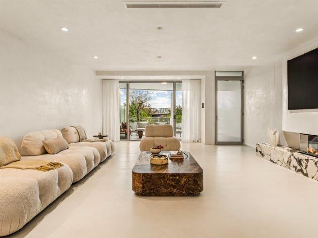 Four level Torrens Title terrace with prestigious resort living & sparkling bay views