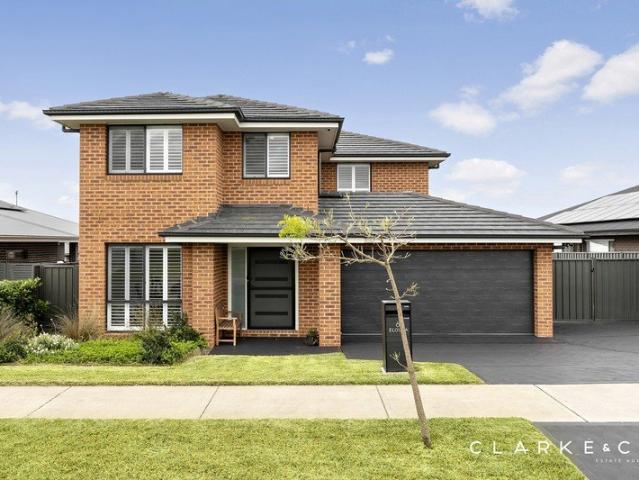 FOUR LIVING AREAS, ONE OUTSTANDING HOME!