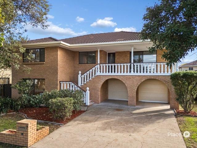 Flexible Dual Level Haven in a Highly Sought After Robertson Pocket