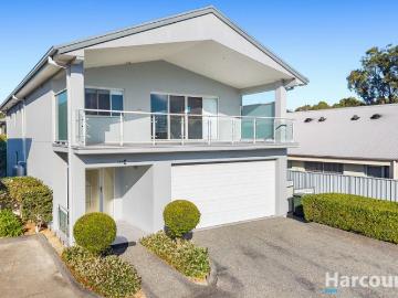 Flexible dual level living in modern home opposite lakefront