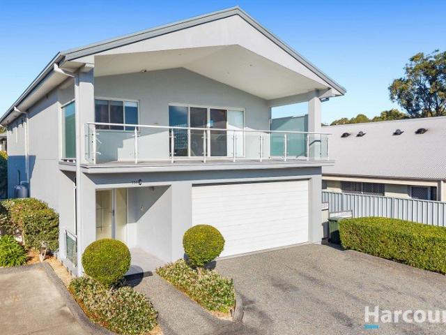 Flexible dual level living in modern home opposite lakefront