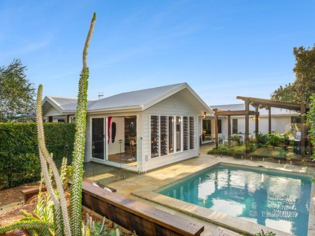 Contemporary Queenslander Charm Meets Timeless Coastal Luxury. Front Row Views. Spectacular Sunsets