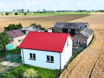 Dom z potencjałem na dużej działce 1,056 ha, garaże