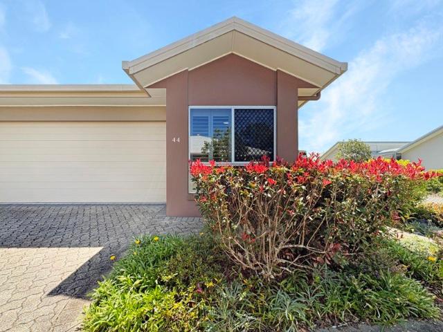 Freehold Kawana Island villa on a quiet corner block with rare double garage and park access