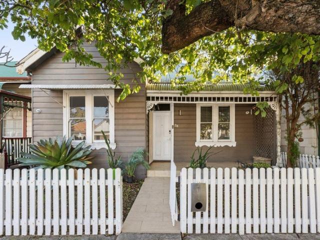 Freestanding Family Home with Rear Lane Access in a Sought After Address