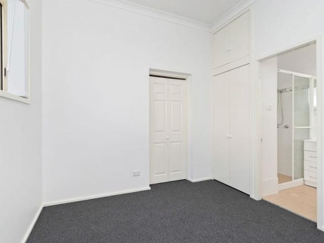 FRESH, LOW MAINTENANCE LIVING WITH OFF STREET PARKING