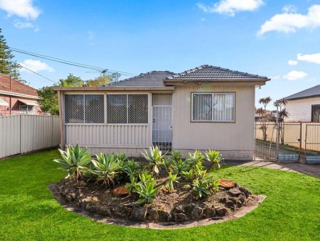 Freshly Painted Home with Spacious Living & Huge Backyard