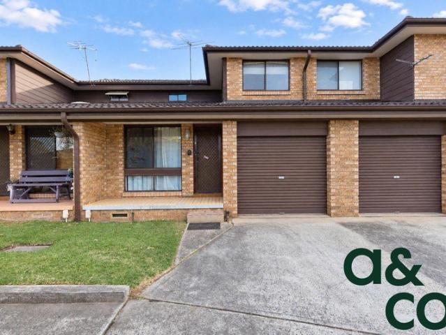 Freshly Painted Townhouse Perfectly Located!