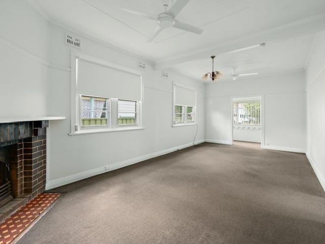 Freshly Painted Two Bedroom Home with Sunroom