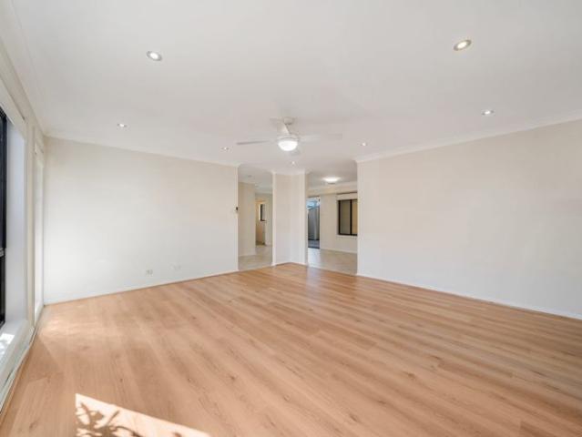 Freshly Refreshed Family Townhouse with Multiple Living Areas!