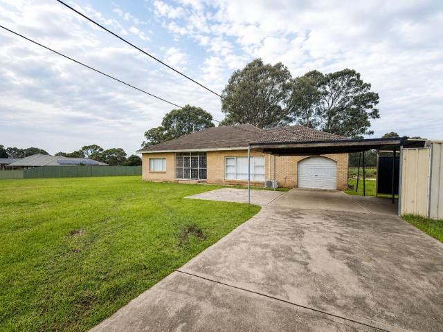 Freshly Updated Acreage Living on 5 Private Acres
