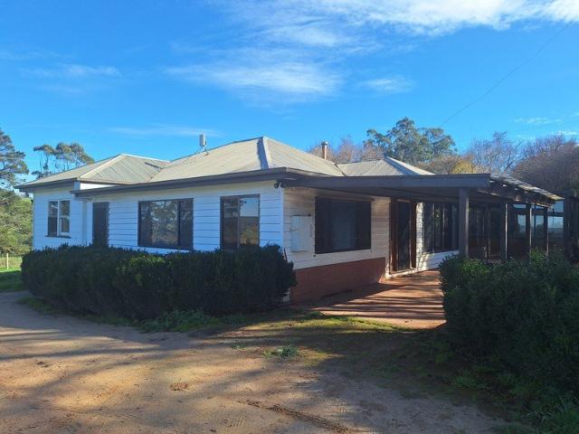 FRESHLY UPDATED FOUR BEDROOM HOME IN PEACEFUL SETTING