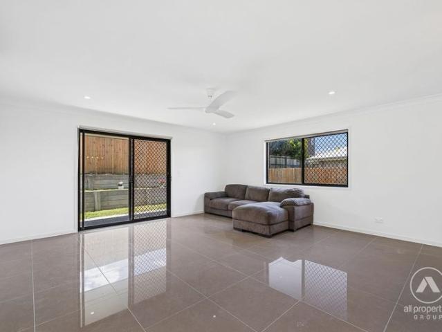 UPDATED FAMILY HOME IN THE HEART OF PIMPAMA!