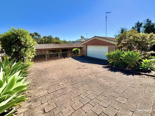 Freshly Updated Split Level Family Home Overlooking Campbelltown Golf Course