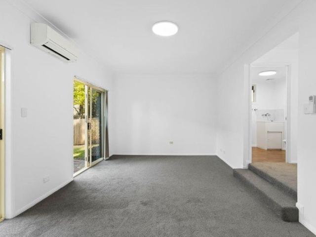 FRESHLY UPDATED WITH GENEROUS PRIVATE COURTYARD