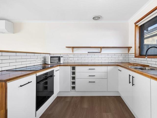Freshly Updated Unit with Modern Kitchen, Solar & Spacious Backyard