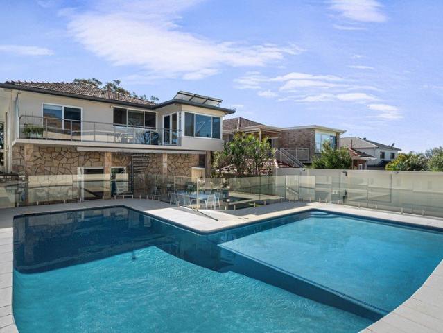 Full brick family haven with resort style poolside living