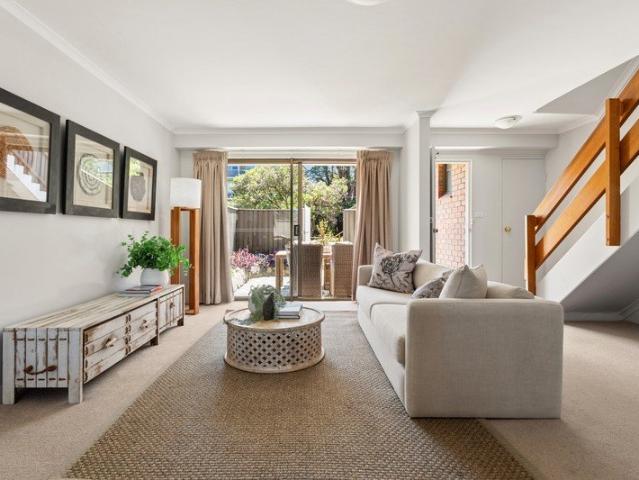 Full brick townhouse enjoys an amazing lifestyle location with City views