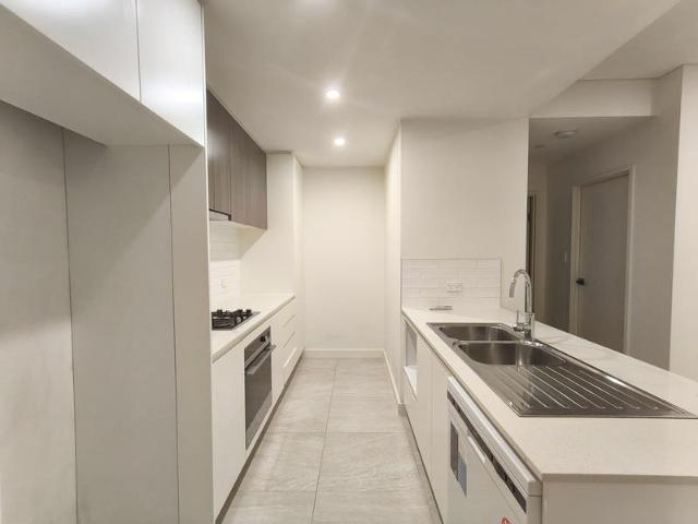 FULL TILED LIVING AND DINING AREA FACING THE BACK OF THE BUILDING