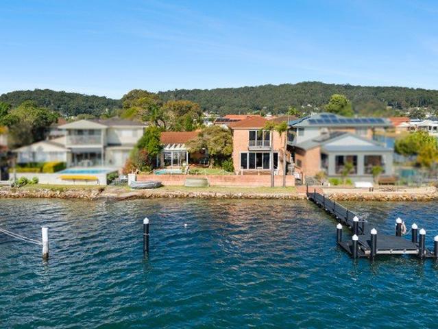 Full Width Outside Waterfront with Jetty, Plus Four Car Garage