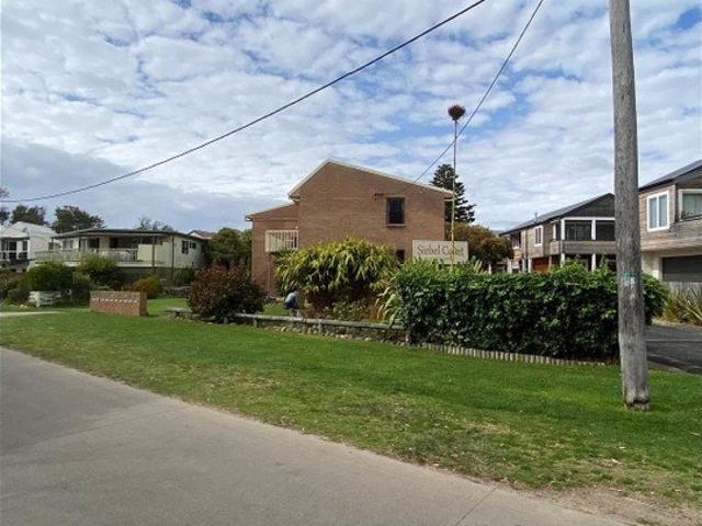 Fully Furnished Coastal Unit Walk to the Water!
