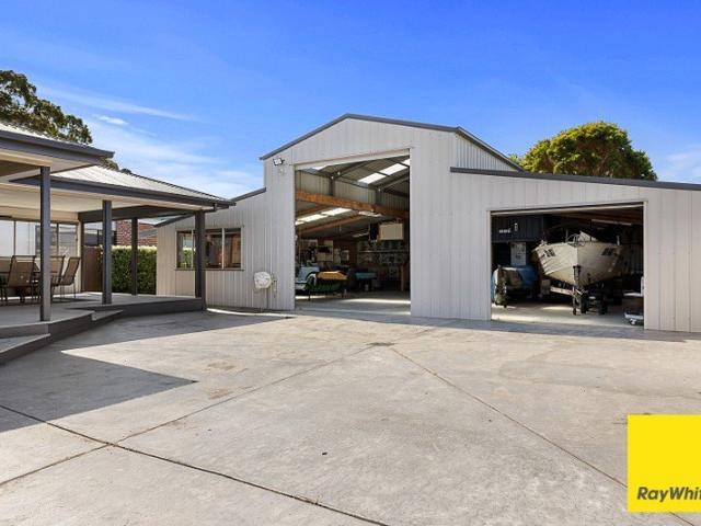 Fully Furnished Coastal Living with the Ultimate Shed Space