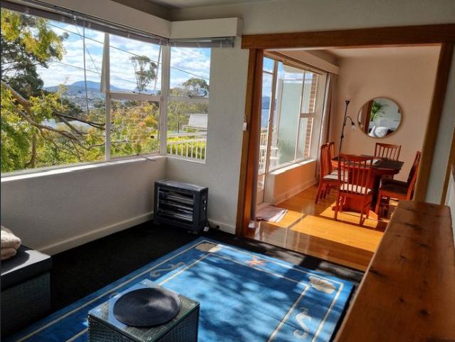 Fully furnished sunny apartment with water and mountain views in Sandy Bay