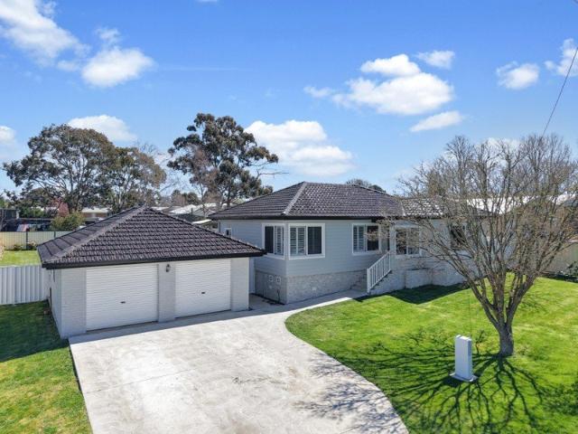 Fully Renovated Home with Side Access & Workshop